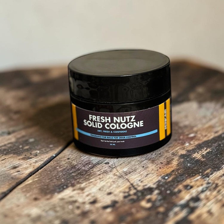 Menkair Fresh Nutz solid cologne for men, portable balm for all-day freshness and odor control.